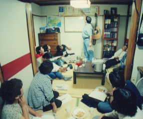 Monday night Bible study in our apartment (Dan pointing to Bible timeline)